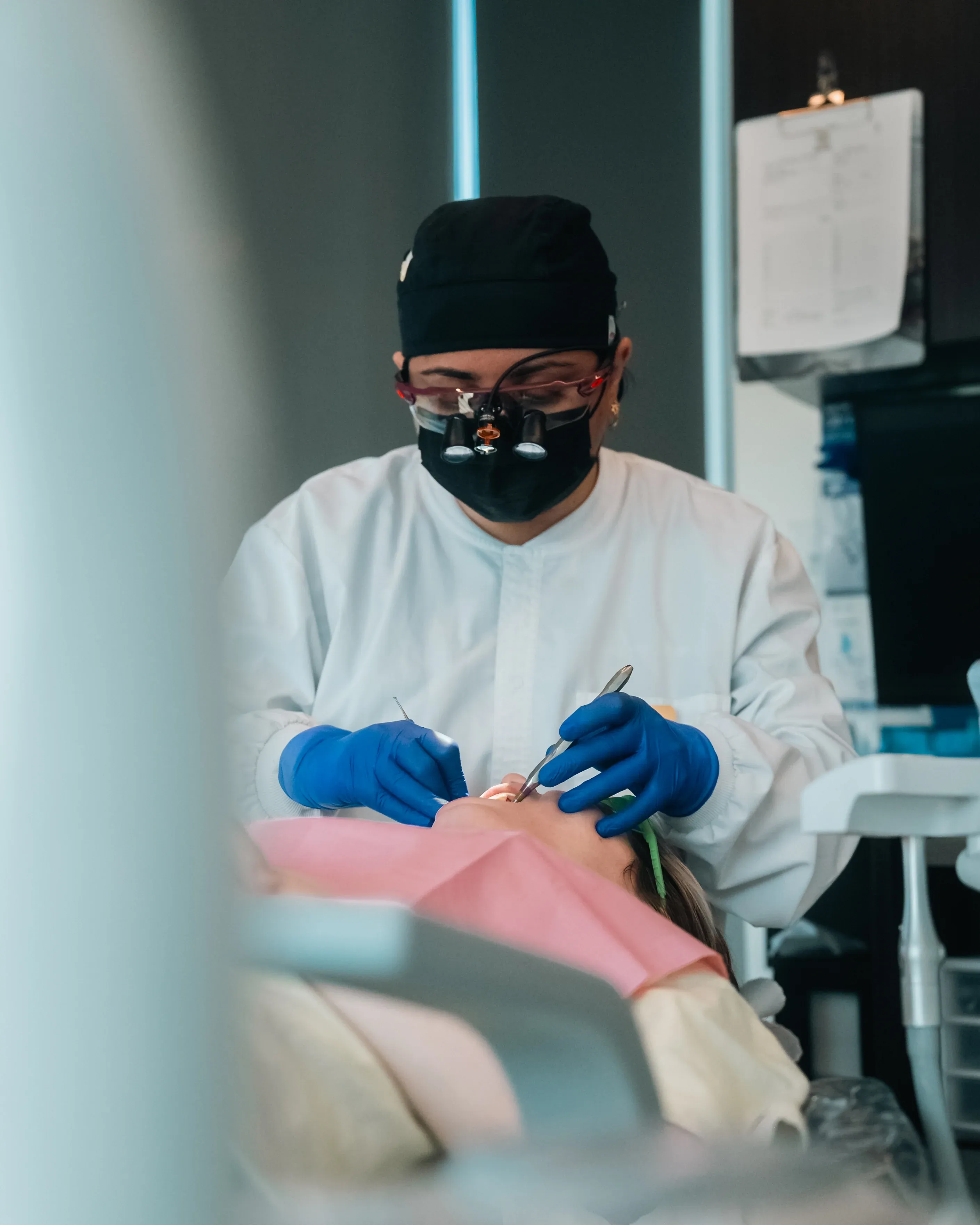 Dental professional performing scaling and root planing treatment in Noblesville, IN.