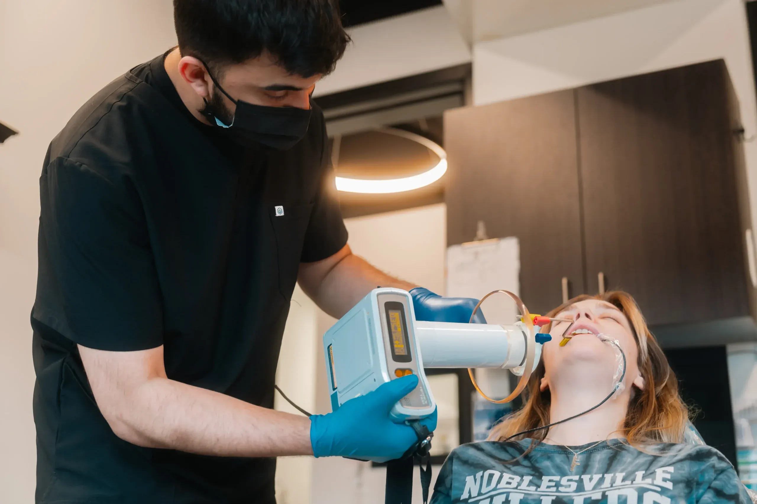 A team member taking a digital dental X-ray at Skyview Dental