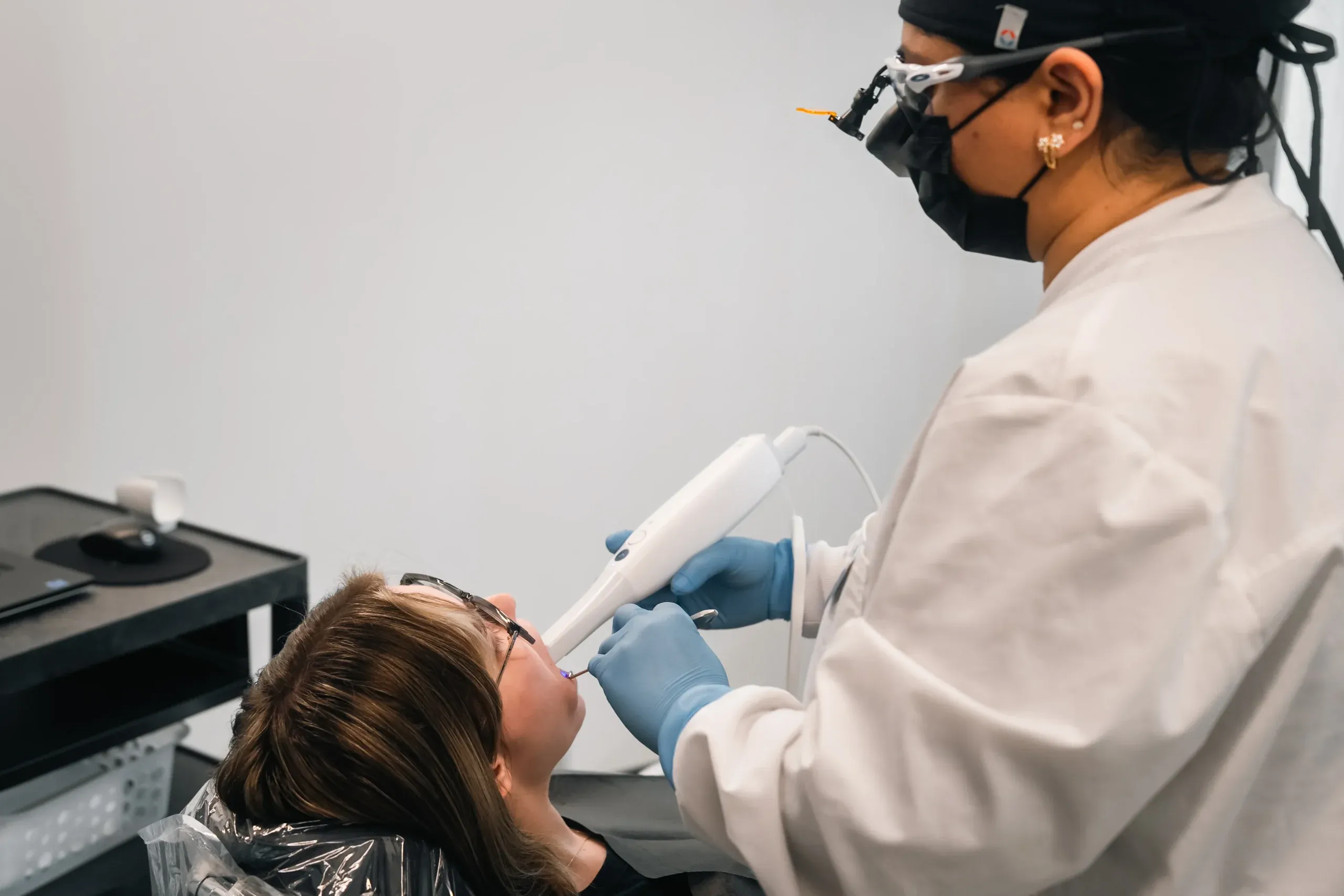 A clinician treating a patient at Skyview Dental