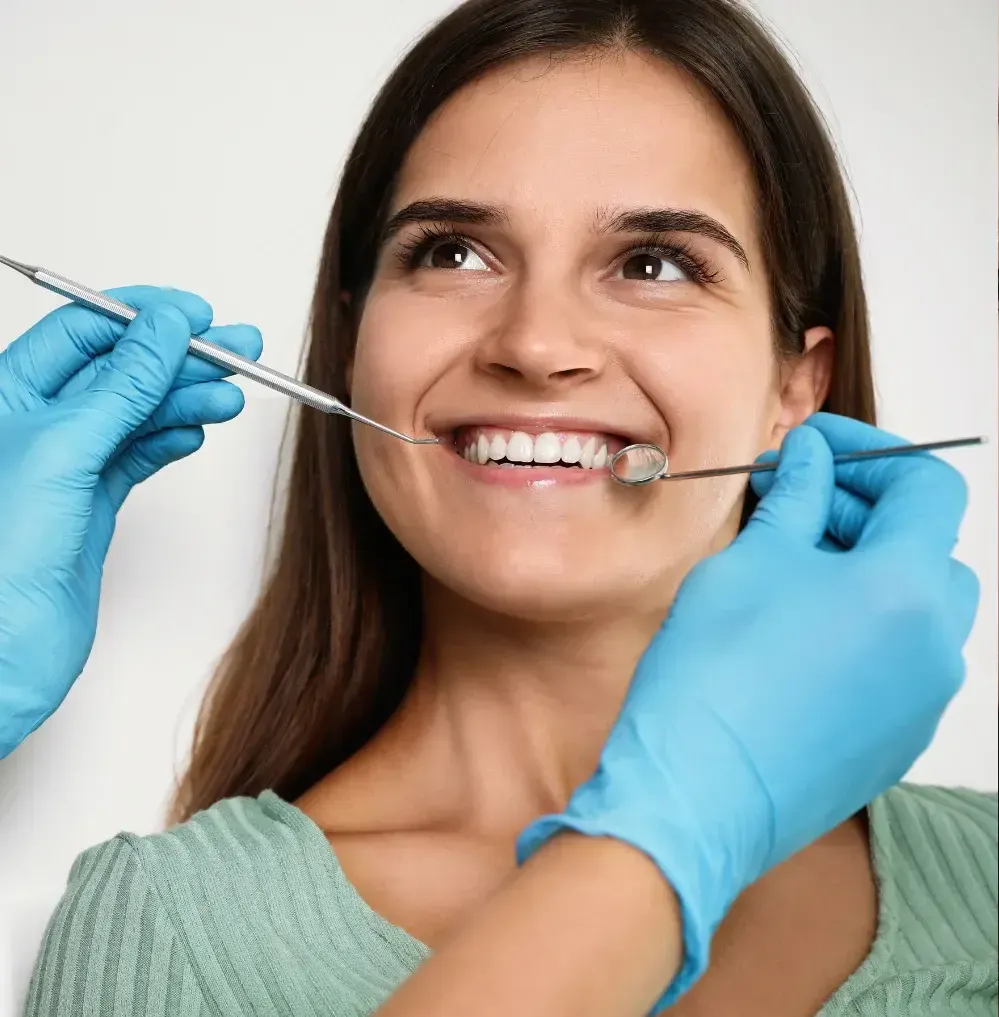 Smiling woman during a cosmetic dental exam