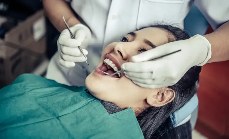 Dentist examining a patient's teeth